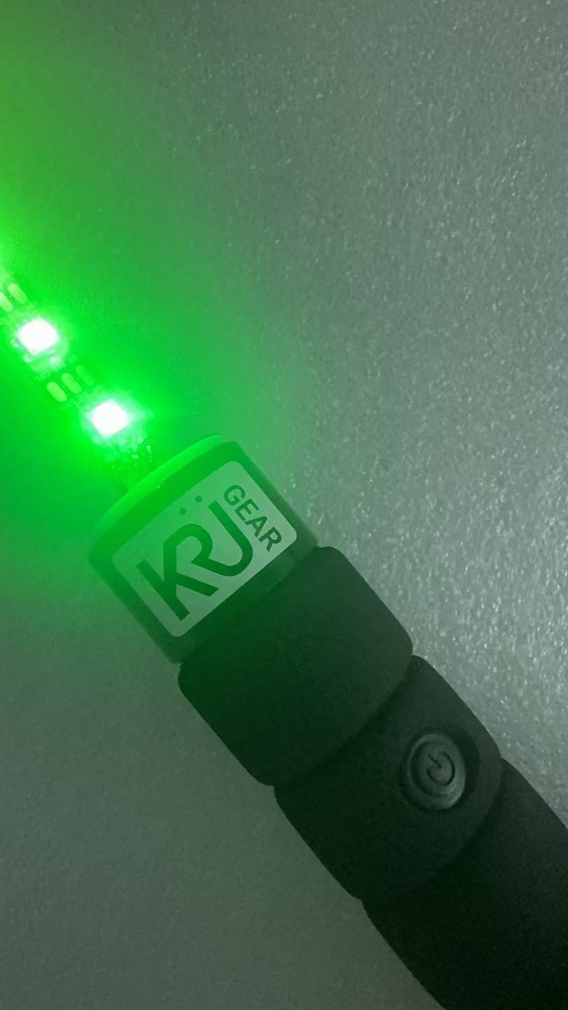 KRÜGEAR branded cap and power button, close up
